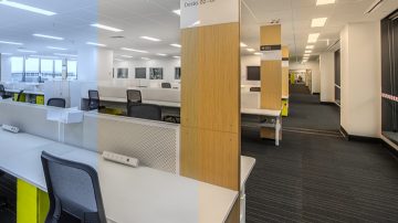 Open-plan office with overhead LED panel lighting