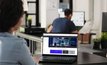 Person using laptop for lighting transactions