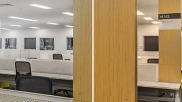 Oficina de planta abierta con iluminación de paneles LED en el techo
