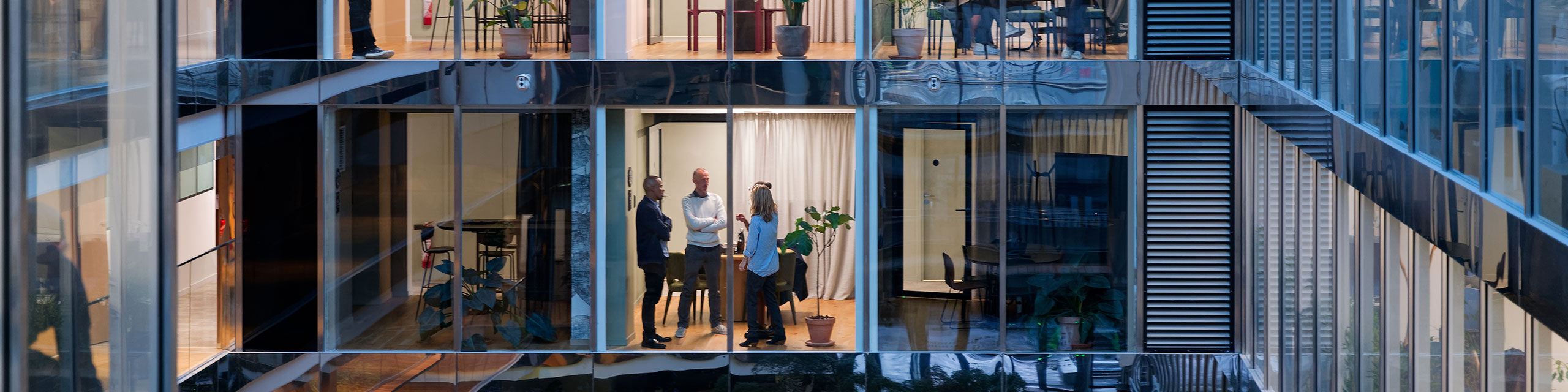 Modern office interior with large windows and bright lighting