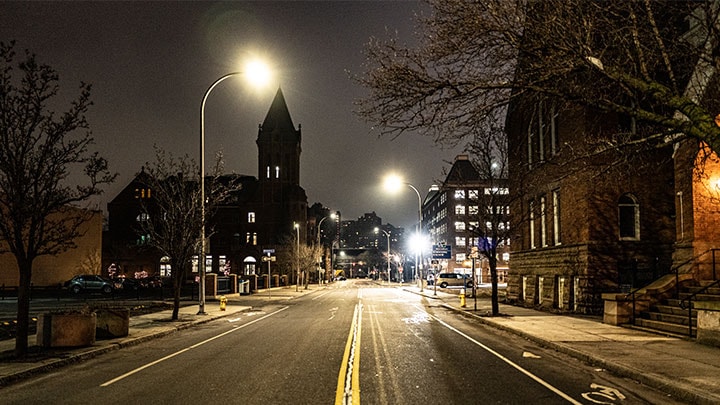 Illuminated street lights in city