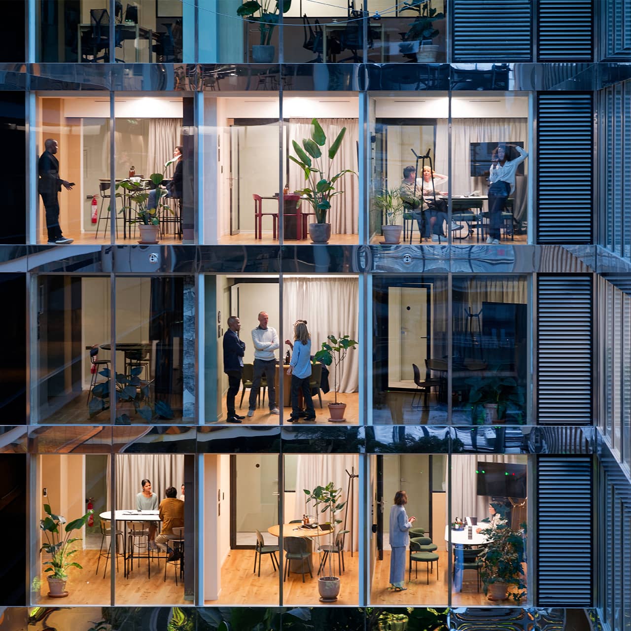 Modern office interior with large windows and bright lighting
