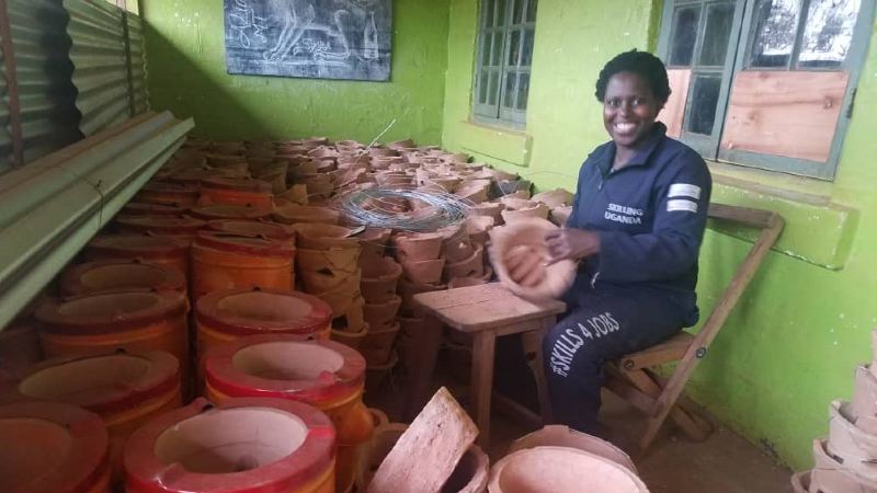 Annet Birungi, Founder of Safe Energy Enterprieses, a New Energy Nexus Uganda awardee, in her cookstove shop.