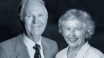 Black and white portrait of Bodine founders Richard 'Dick' and Virginia 'Jinnie', smiling together