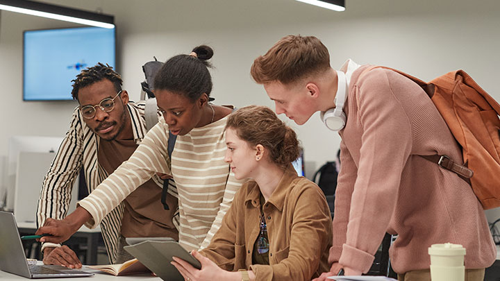 Students working in a brightly lit classroom with natural light