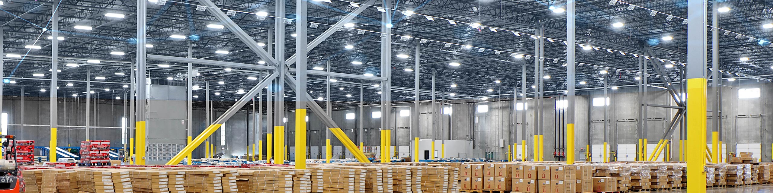 Warehouse interior with bright overhead LED lighting