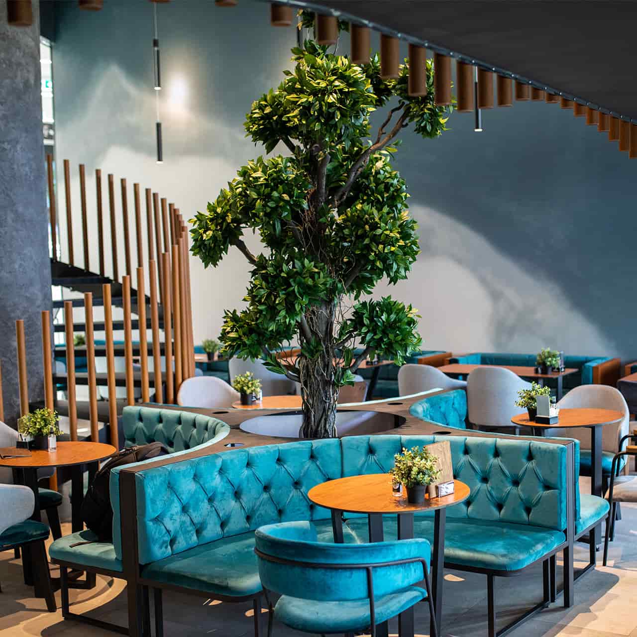 Cafe with teal seating and warm ambient lighting