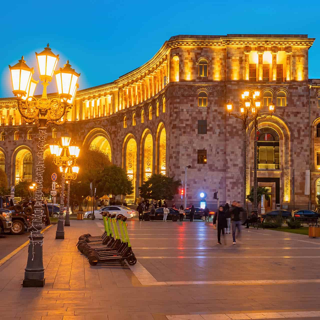 City square at night with warm outdoor lighting