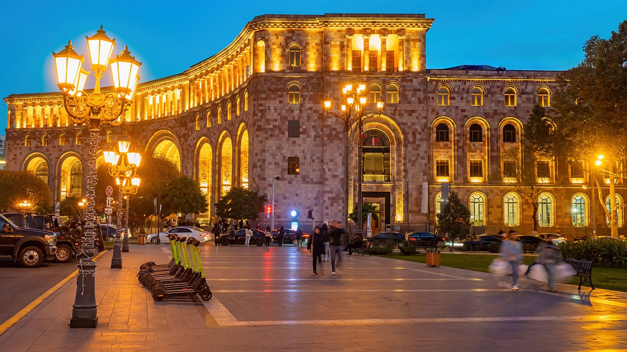 City square at night with warm outdoor lighting