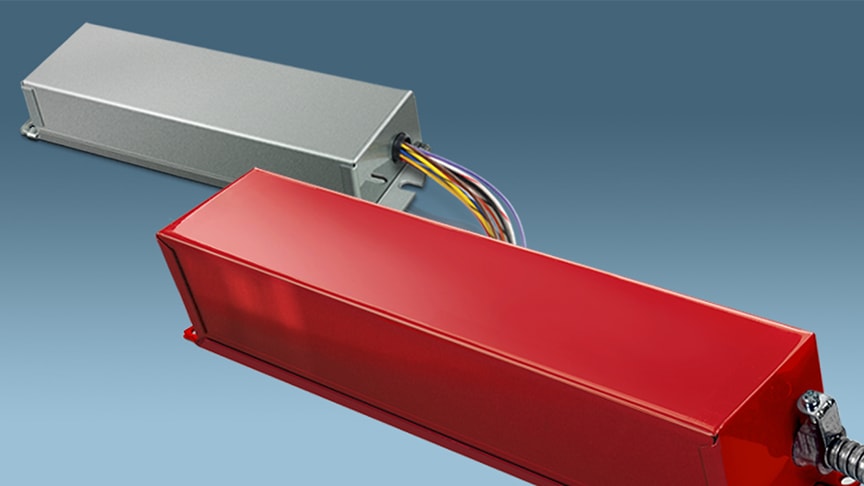A selection of obsolete Bodine emergency lighting ballasts in red and grey