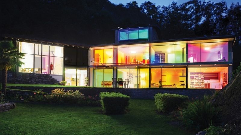 House using WiZ to light its many windows in different colors