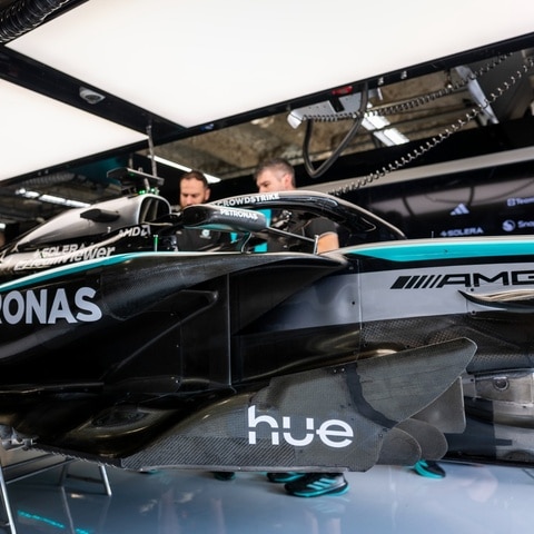 Close up on Mercedes-AMG PETRONAS F1 Team bolide detail with Philips Hue logo
