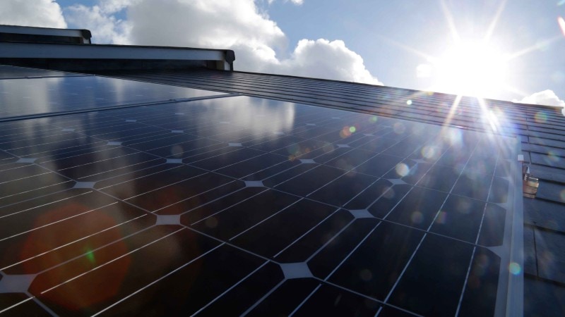Solar panels, sun and blue sky