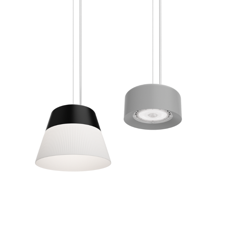 Two pendant lights hanging side by side. The left pendant light features a white dome with a soft, warm glow, while the right pendant light is black with a reflective inner surface, giving a more focused, diffused light. 