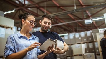 Person using a smartphone app to control connected lighting