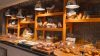 Warmly lit bakery display with bread