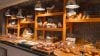 Warmly lit bakery display with bread