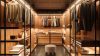 Luxury walk-in wardrobe with warm lighting