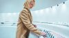Woman browsing products in modern retail store