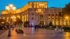 City square at night with warm outdoor lighting