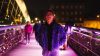 Person in colored lighting outside