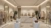 Modern retail store with white lighting highlighting clothing